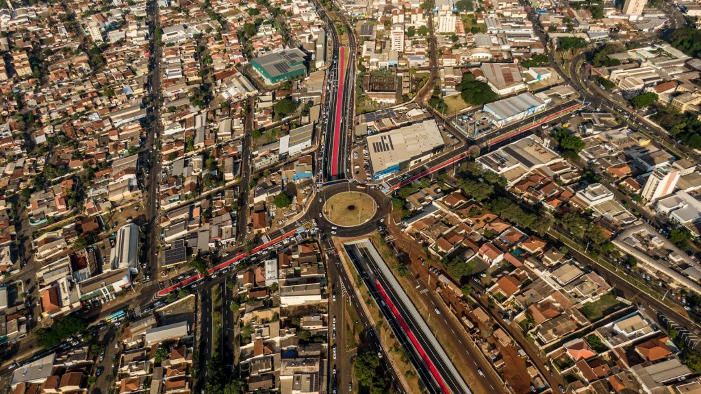 High-angle aerial view of a roundabout in Londrina, Brazil, capturing bustling urban life.