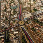 High-angle aerial view of a roundabout in Londrina, Brazil, capturing bustling urban life.