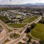 Stunning aerial view of Campos dos Goytacazes, Brazil, showcasing urban and green landscapes.