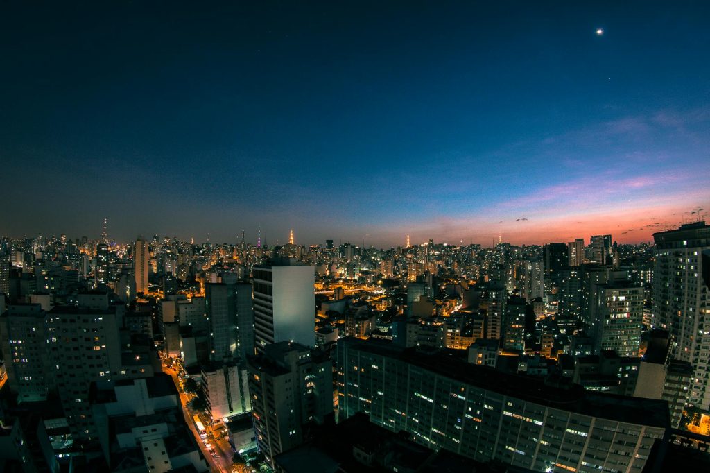 A breathtaking view of São Paulo's skyline at twilight, showcasing vibrant city lights and skyscrapers.