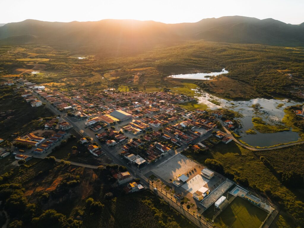 Stunning aerial view of Encanto, RN, Brazil with hills and lakes at sunset.
