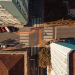 Top-down view of a street intersection in Florianópolis, capturing urban architecture and traffic.