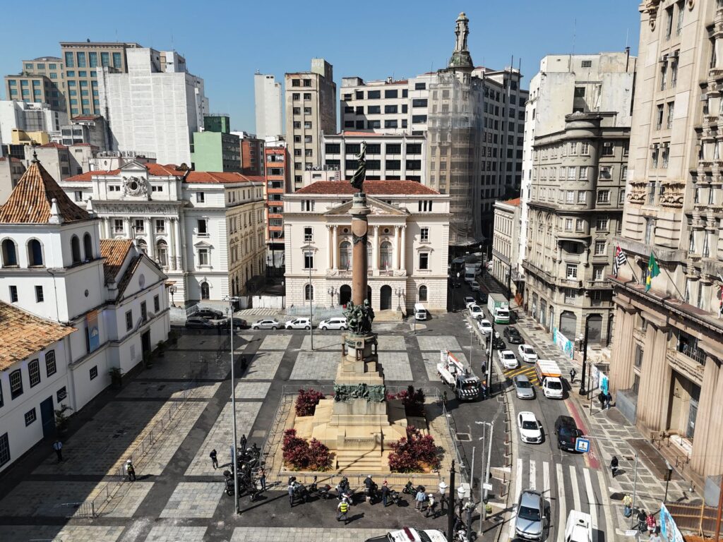 Aerial view of Praça da Sé in São Paulo city featuring historic architecture and a central monument.