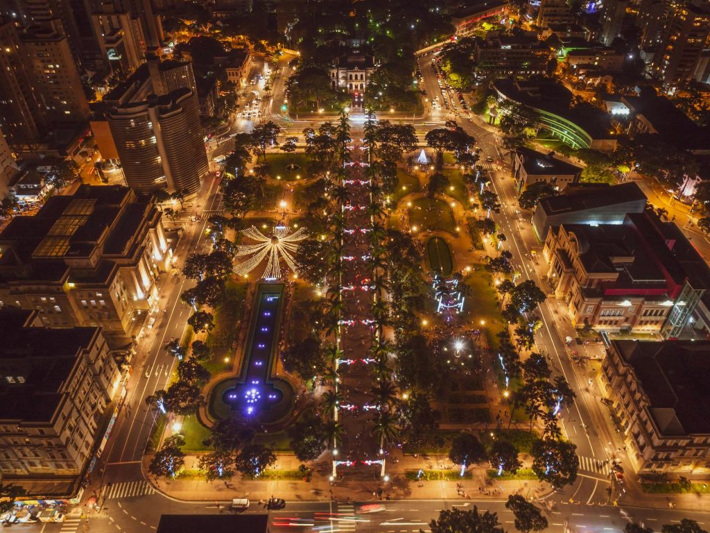 Stunning aerial view of illuminated Belo Horizonte cityscape at night, highlighting urban lights and architecture.