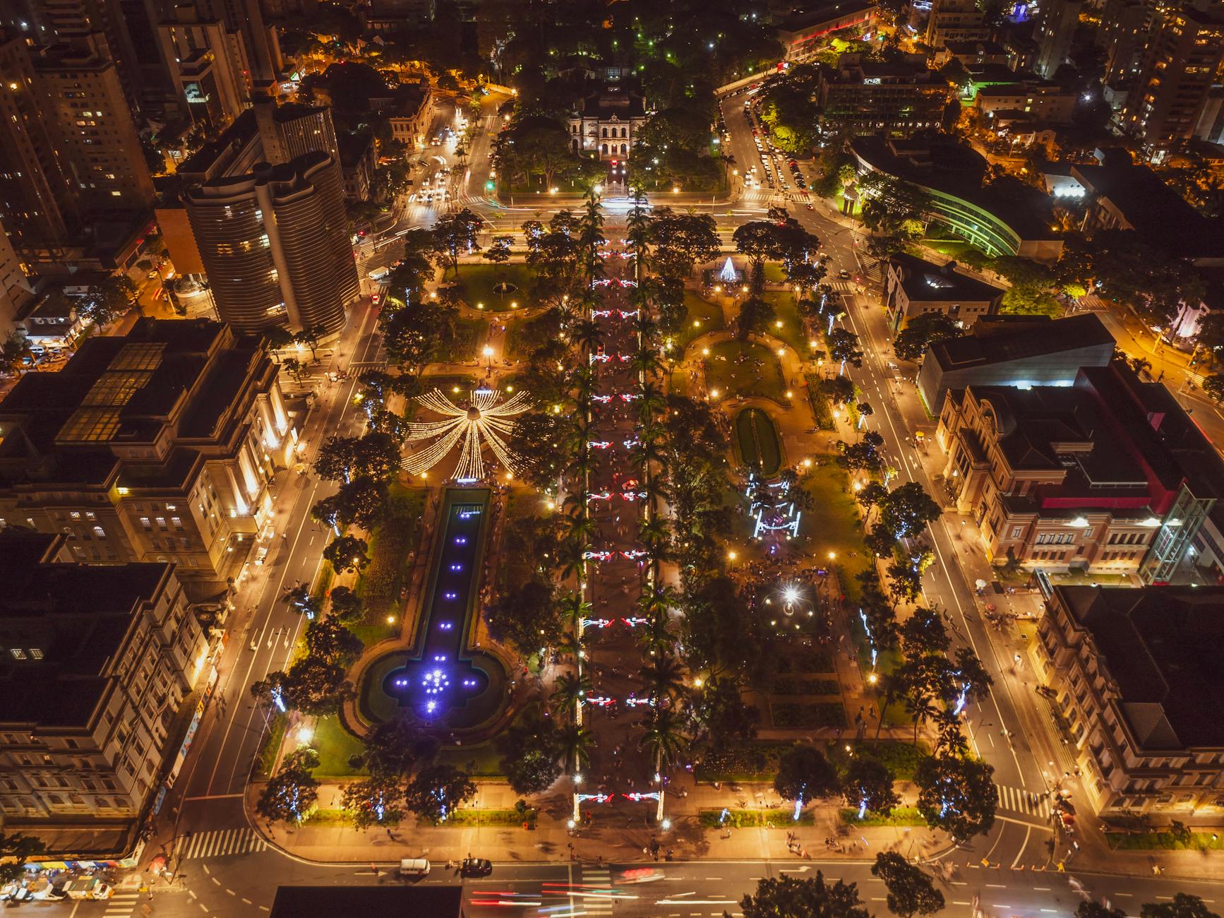 Stunning aerial view of illuminated Belo Horizonte cityscape at night, highlighting urban lights and architecture.
