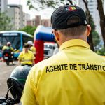 Traffic agent overseeing road operations in Londrina, Brazil, on a busy street.