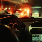 A man's perspective driving through São Paulo at night, focusing on city lights and traffic.