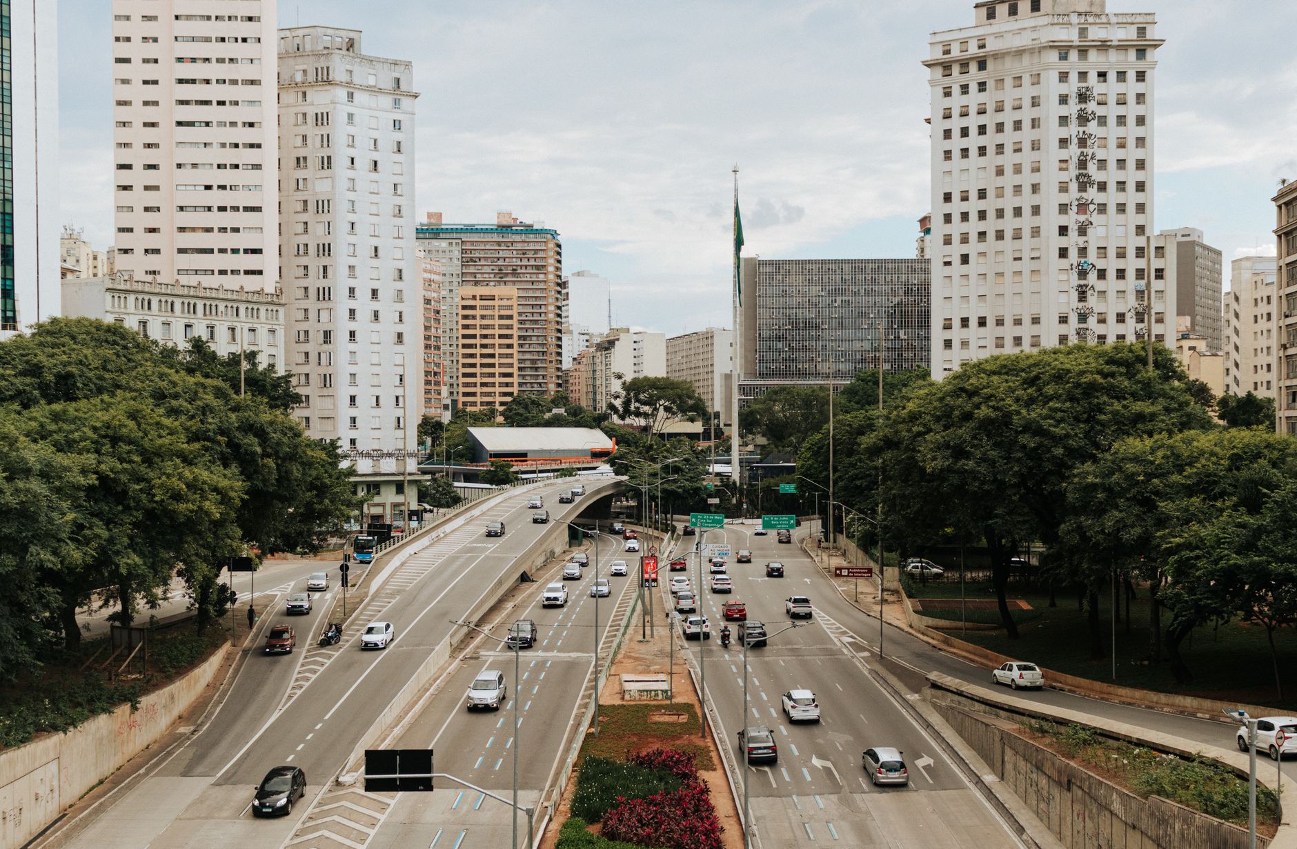 A bustling view of São Paulo's urban landscape with highways and tall buildings, capturing city life.