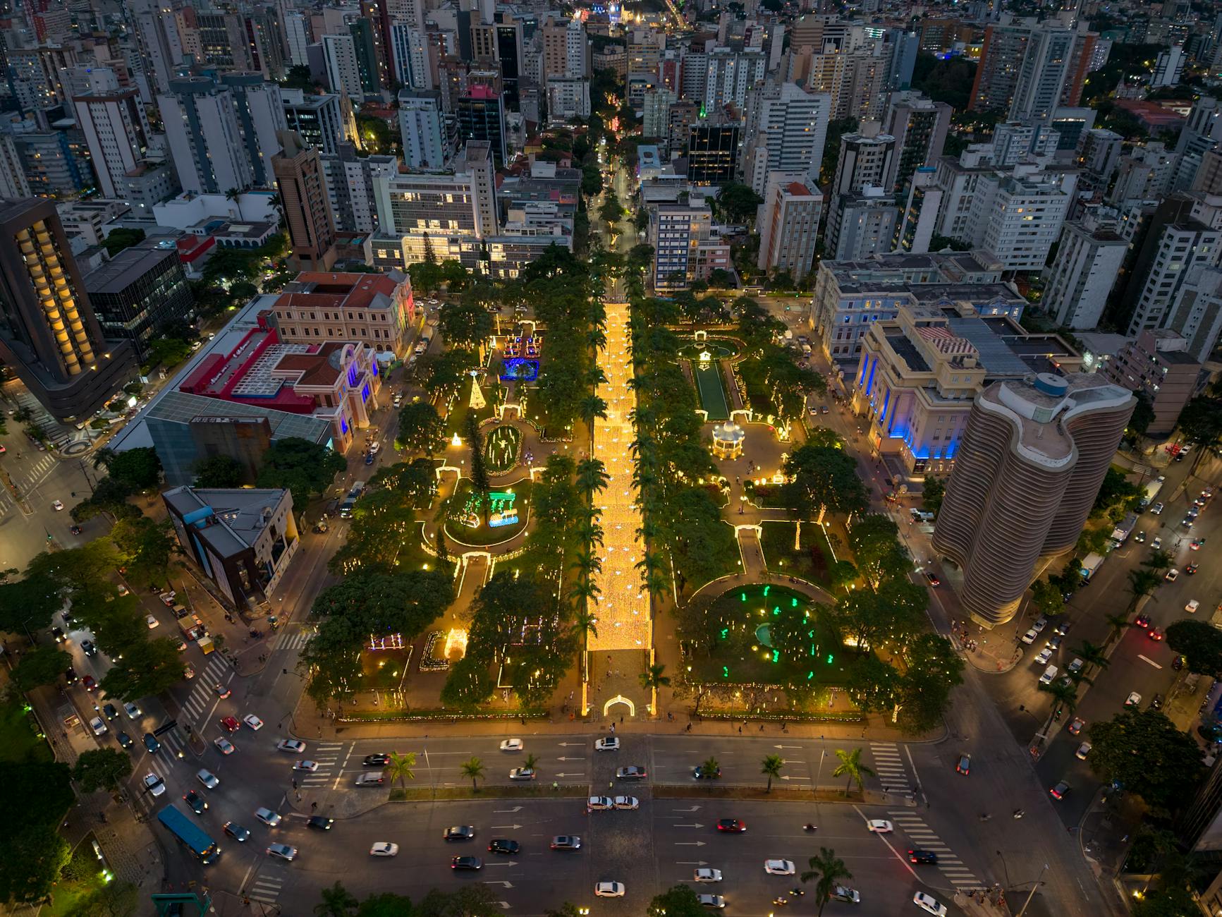 Aerial cityscape of Praça da Liberdade in Belo Horizonte at night, beautifully illuminated.