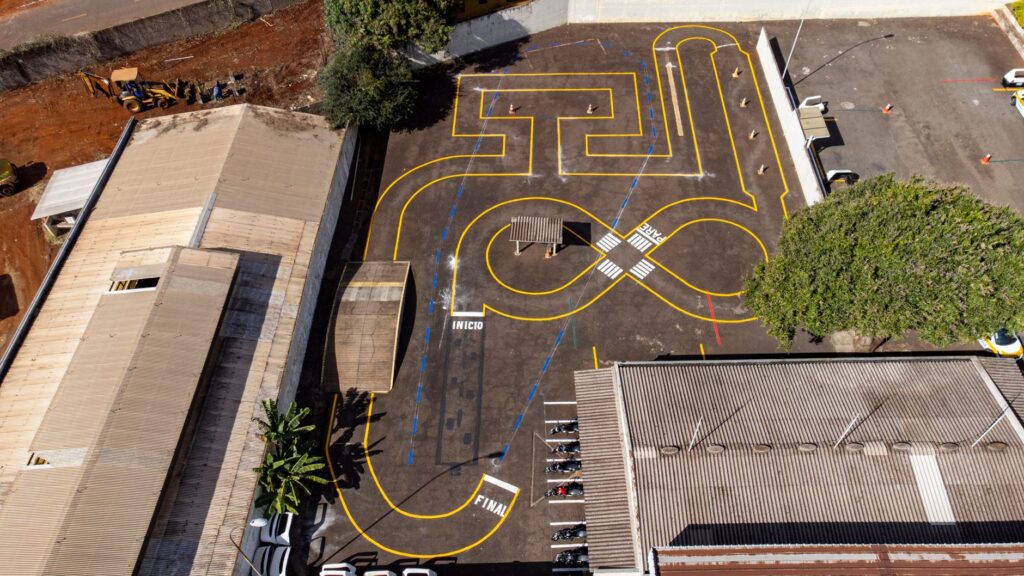 Aerial shot of a parking lot with traffic training markings in Londrina, Brazil.