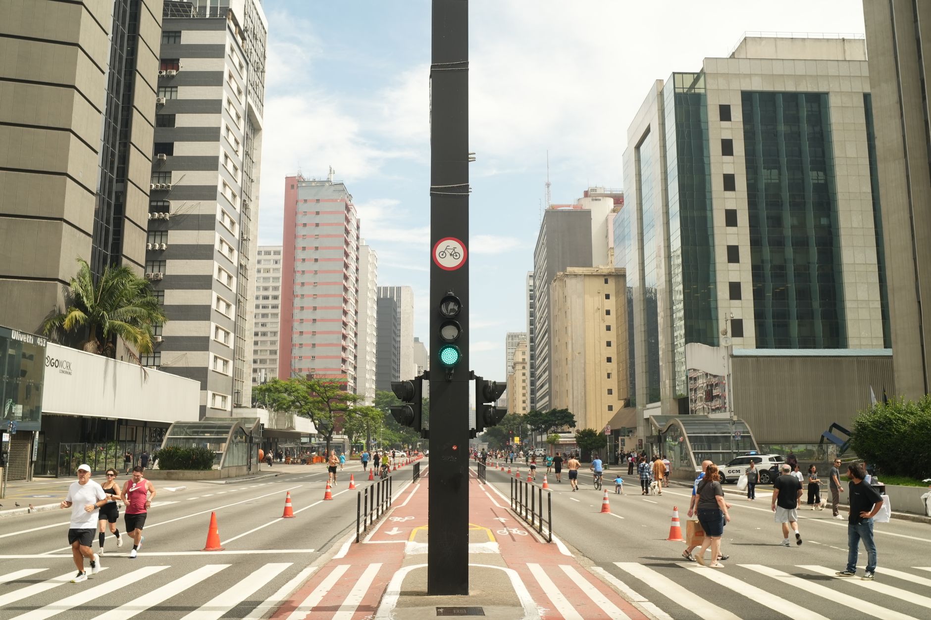 A bustling scene on Avenida Paulista in São Paulo with pedestrians enjoying a car-free day.