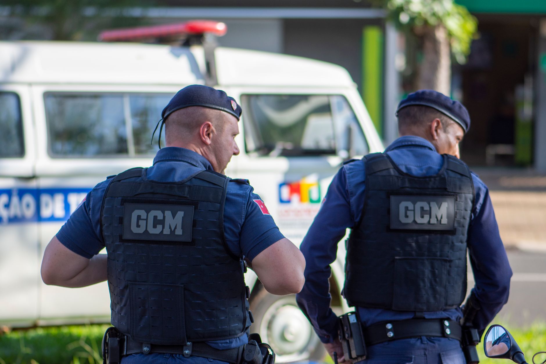 Two municipal guards in uniform patrolling the streets of Londrina, Brazil.