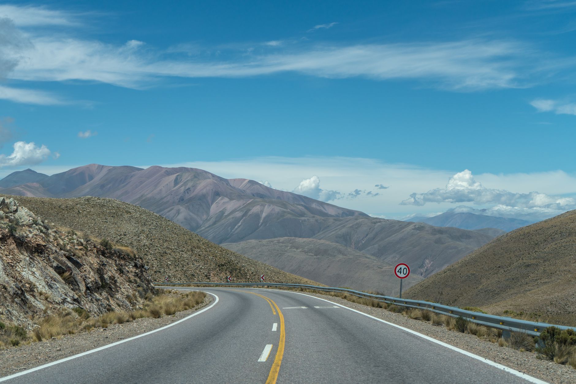 A stunning view of a winding road through mountains in San Salvador de Jujuy, Argentina.