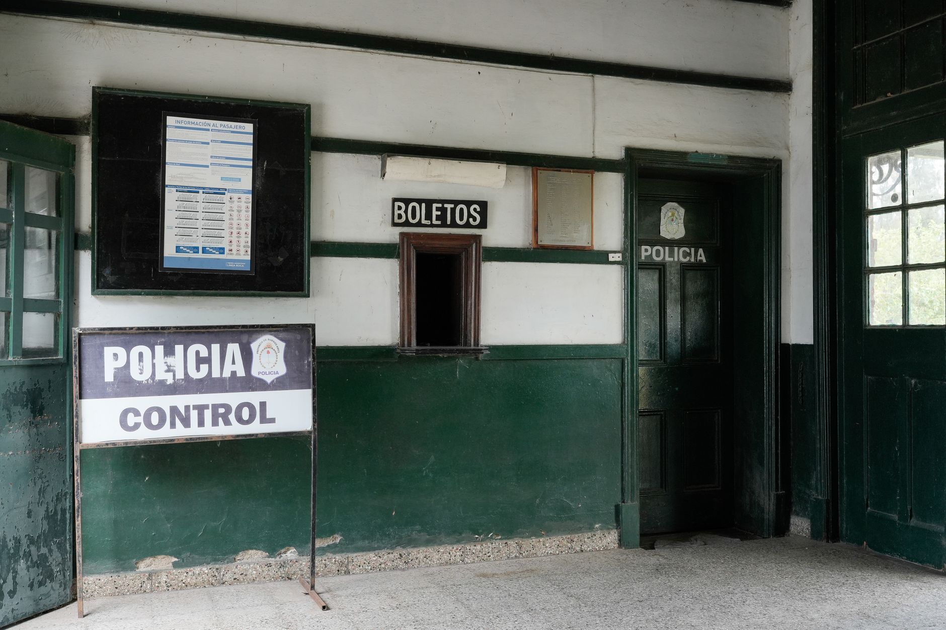 Interior view of an old police office in Uribelarrea, Argentina with ticket window.
