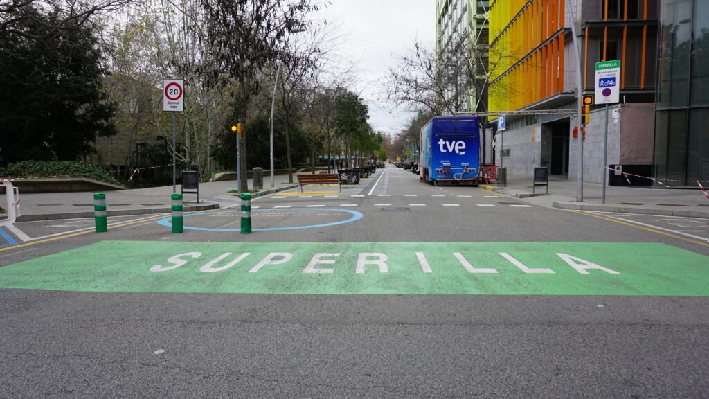 a street with a painted street sign on the side of it