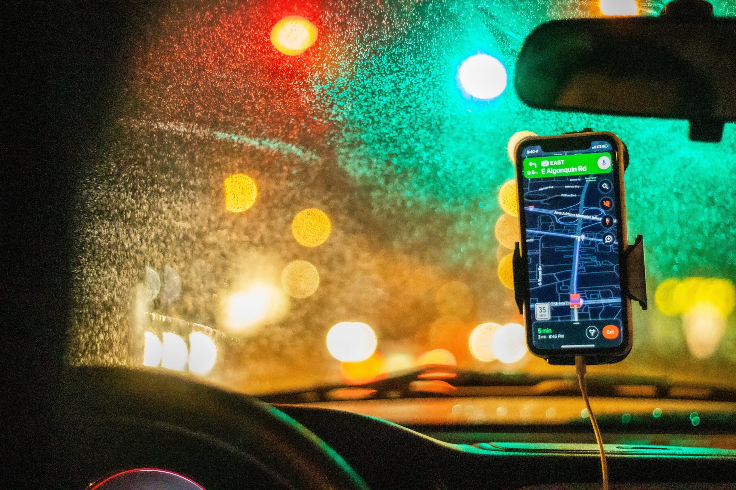 white smartphone on car dashboard