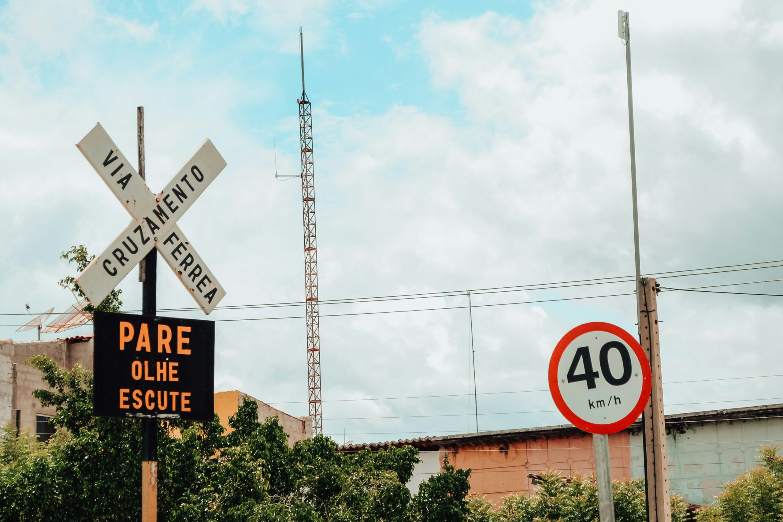 Railroad crossing signs with speed limit sign.