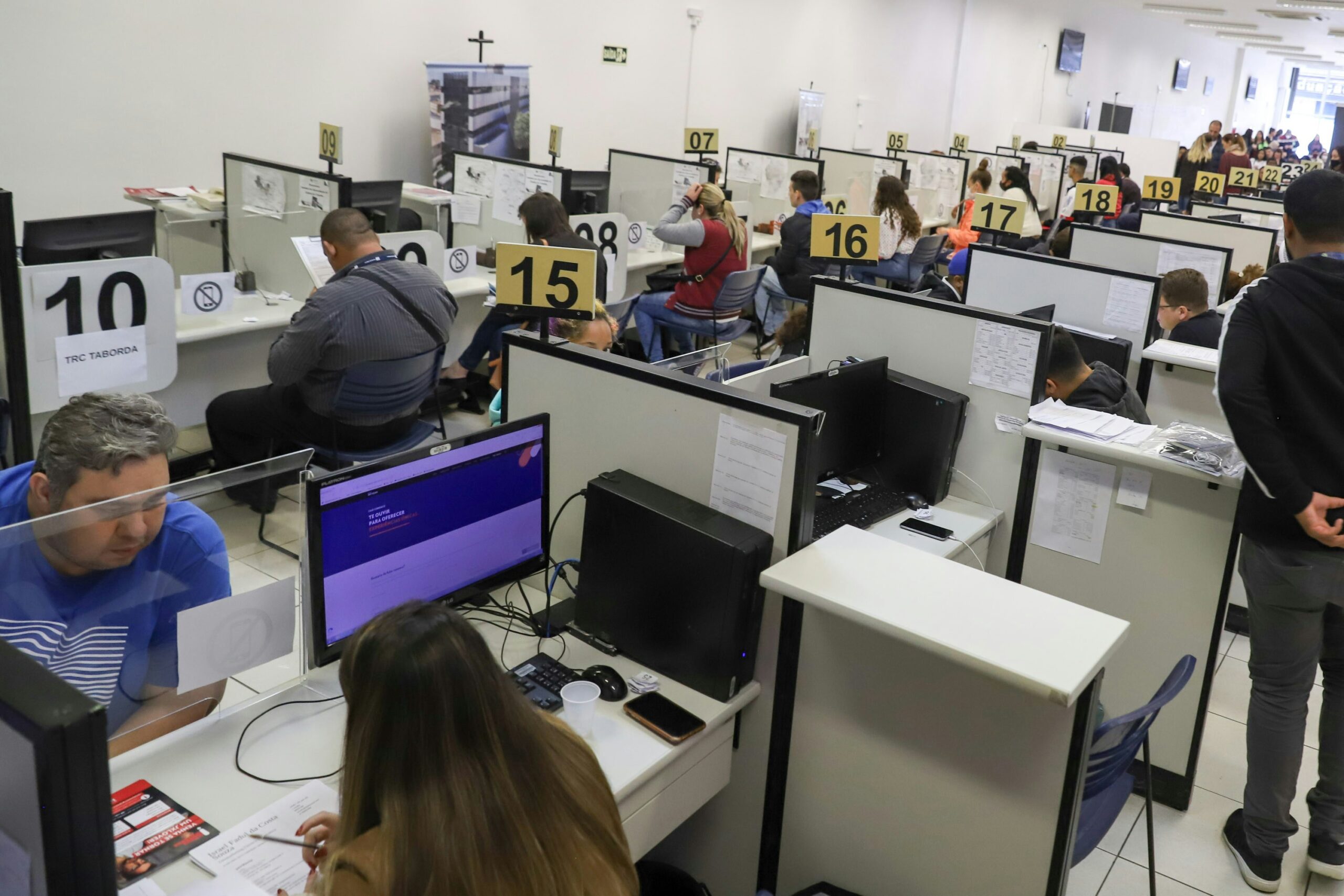 a room full of people working on computers